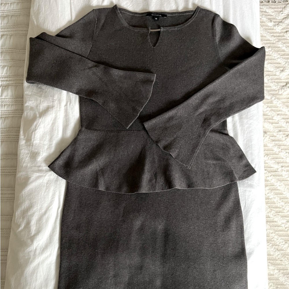 Soft, knit dress with peplum waist.